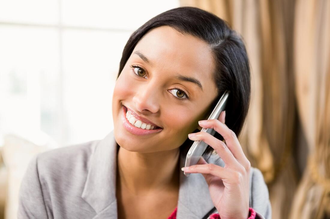 customer service smiling taking phone call